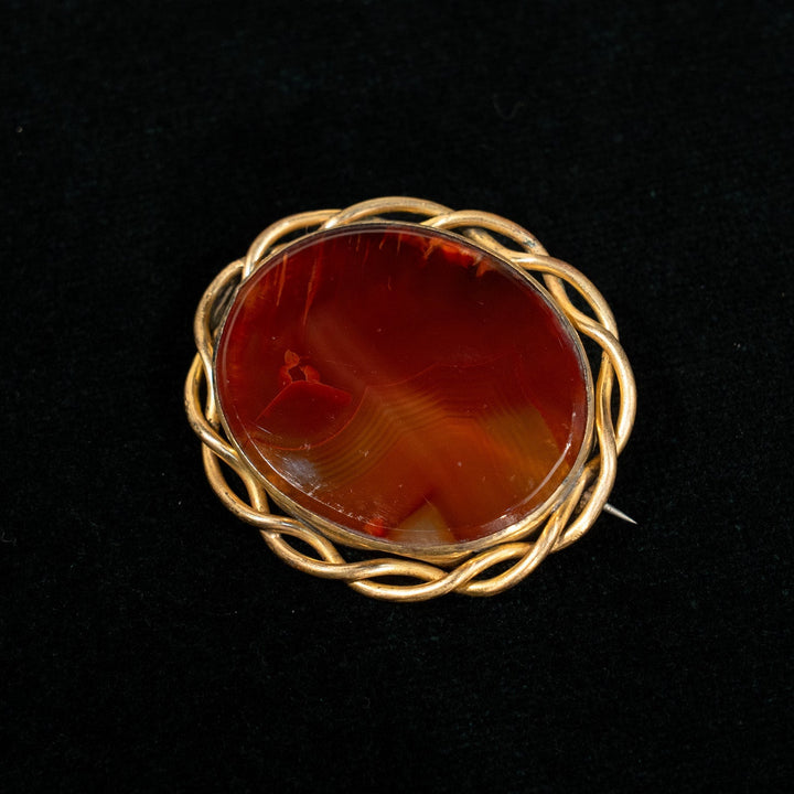 ツイストロープのフレームにセットされた瑪瑙が独特の雰囲気を醸し出す アゲート オーバルブローチ /23K