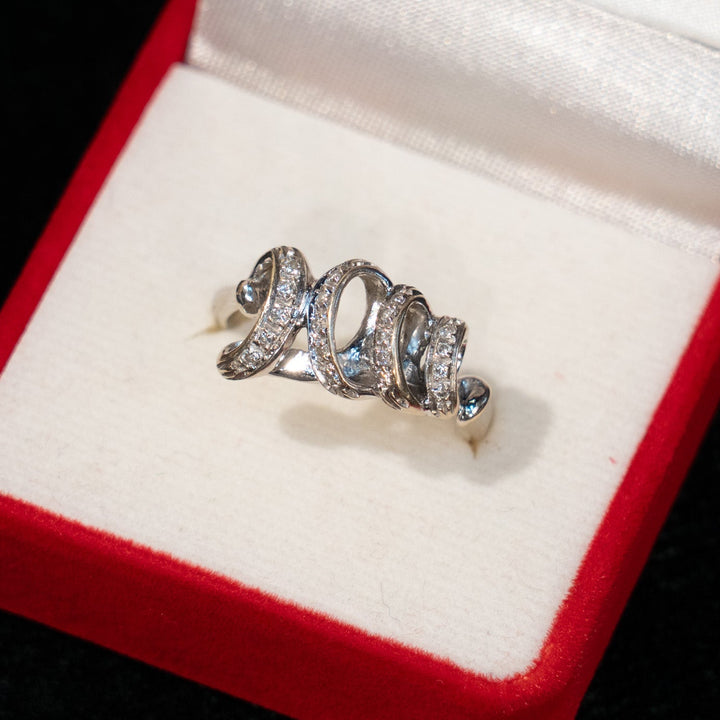 優雅な渦巻模様が立体感のある輝きを放つ ダイヤモンド アンティークリング /23K