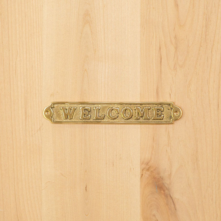 気持ちよく迎え入れてくれそうなドアを演出！重厚感ある真鍮製サインプレート（WELCOME）[m]